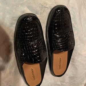 Black slip on Mules.  Size:8.5